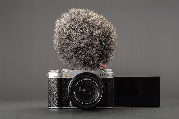 Fujifilm X-M5 vlogging camera with screen extended and external mic attached