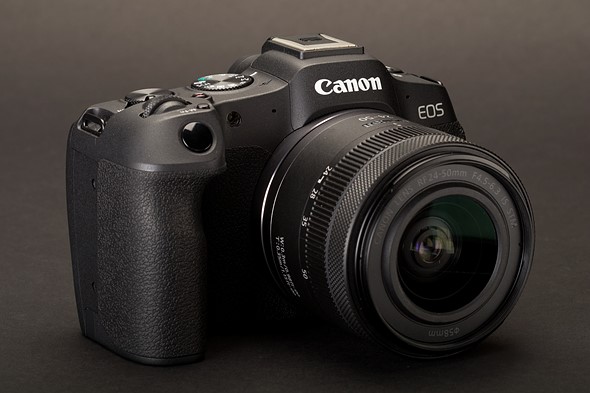 Photo of the Canon EOS R8 against a grey background