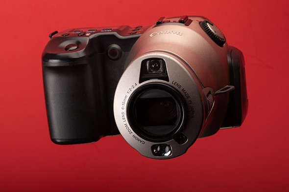 Canon Pro70 hanging in front of red background