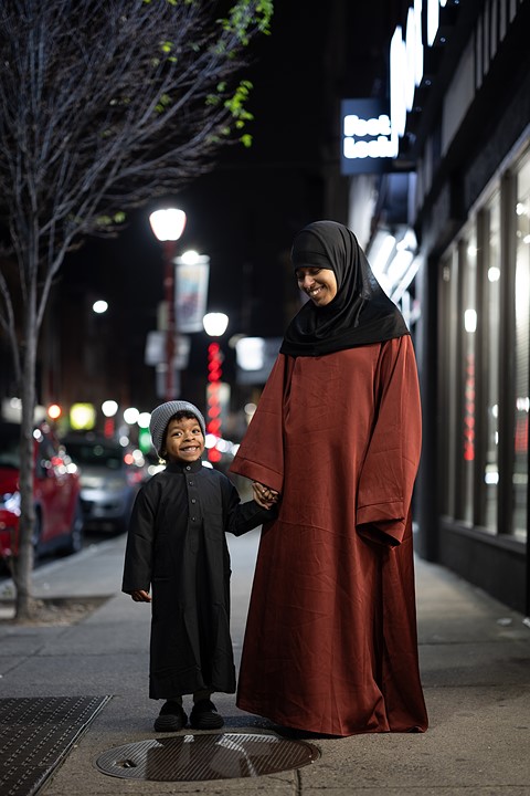 Portrait by South Street Sam - mother and son at night
