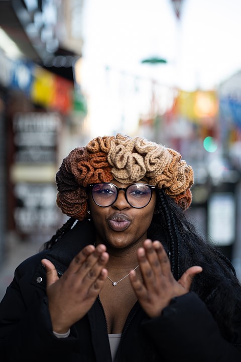 Portrait by South Street Sam - woman blowing kiss