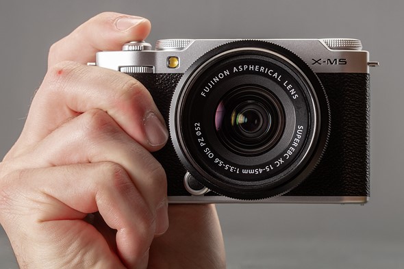 Photo of the X-M5 being held in one hand