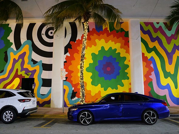 A colorful mural covers the wall of a building in Miami s South Beach neighborhood