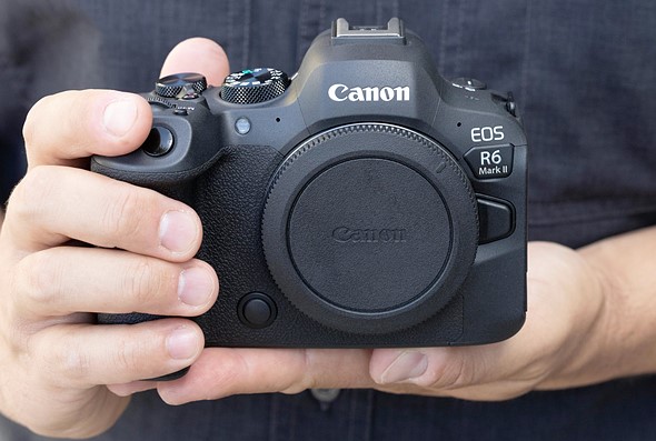 Picture of someone holding the Canon EOS R6 II