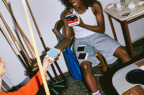 582048-Polaroid Flip Comms Lifestyle 3x2 04-8ff4d7-original-1741954715