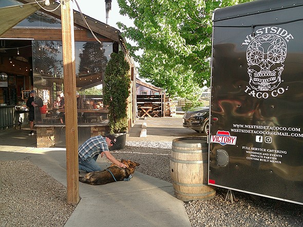 A man petting his dog