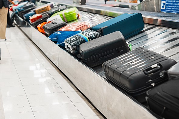 bags on airport baggage claim conveyer belt