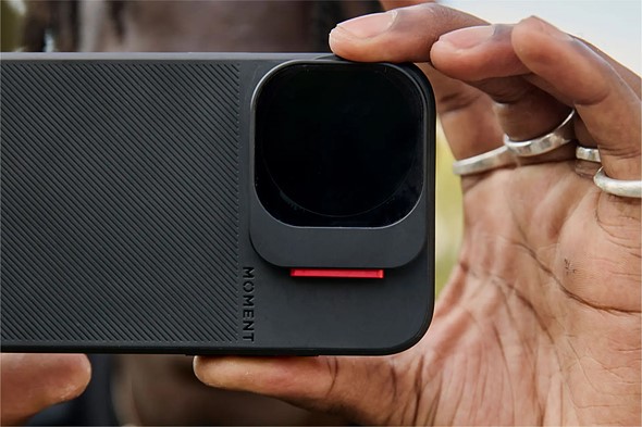 hand holds phone with moment case and filters