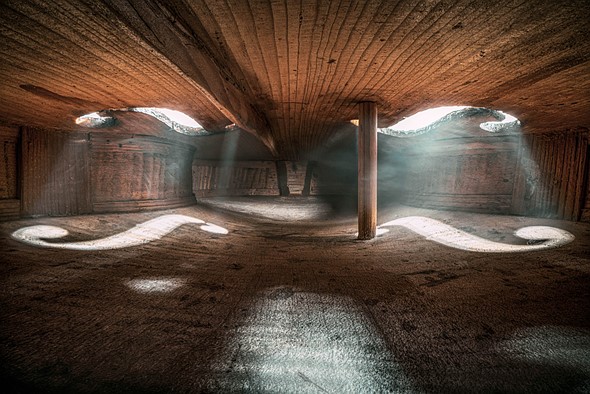 inside violin with light shining through holes