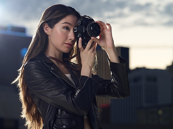 person shooting with nikon zf