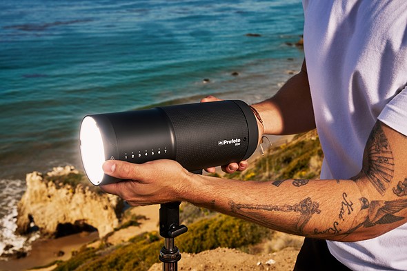 a person holds the profot b30 in front of ocean