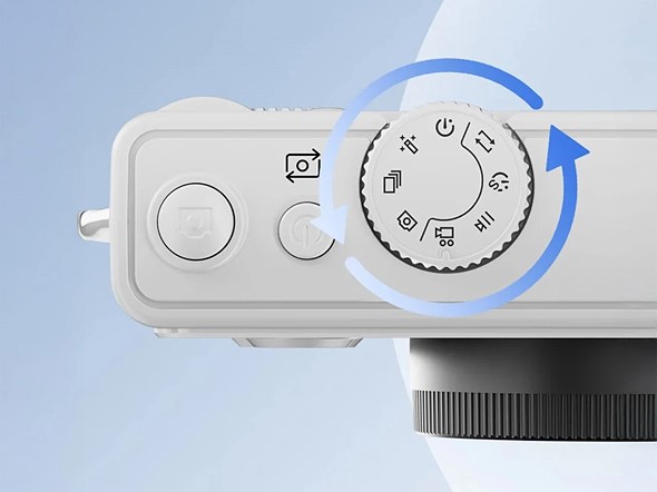 a top view of the lenovo c55 camera with blue arrow pointing around mode dial
