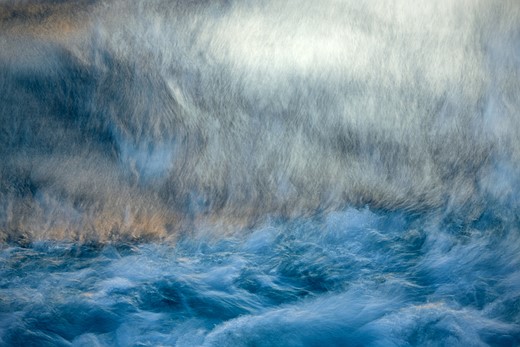 blurry smears of blue and golden colored water