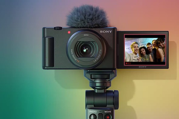 zony zv-1II with screen flipped out against rainbow colored background