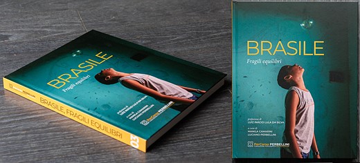 a blue book with yellow spine sites on a table next to an image of the book cover