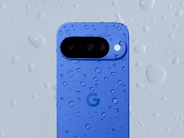 a blue phone is on a gray background with both covered in water drops
