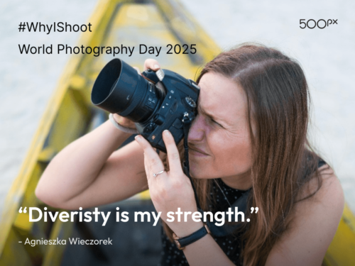 World Photography Day 2025 quote graphic featuring Agnieszka Wieczorek aiming her camera while seated in a yellow boat, paired with the quote: ‘Diversity is my strength.’