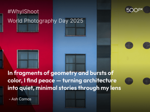 World Photography Day 2025 quote graphic featuring a colorful architectural facade with red, blue, and yellow sections and symmetrical windows, paired with Ash Camas’ quote: ‘In fragments of geometry and bursts of color, I find peace — turning architecture into quiet, minimal stories through my lens.’