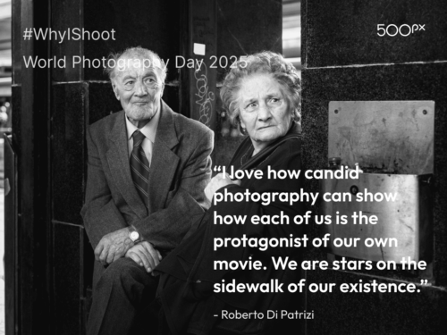 World Photography Day 2025 quote graphic featuring a black and white candid photo of an elderly man and woman sitting outside a building, paired with Roberto Di Patrizi’s quote: ‘I love how candid photography can show how each of us is the protagonist of our own movie. We are stars on the sidewalk of our existence.’