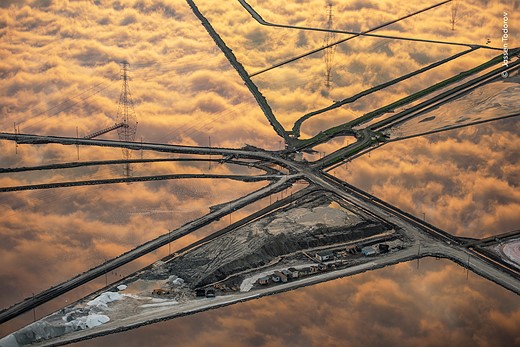 the clouds reflected in salt ponds that span San Francisco Bay