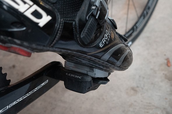 Close-up of a cycling shoe attaching to a clippless pedal