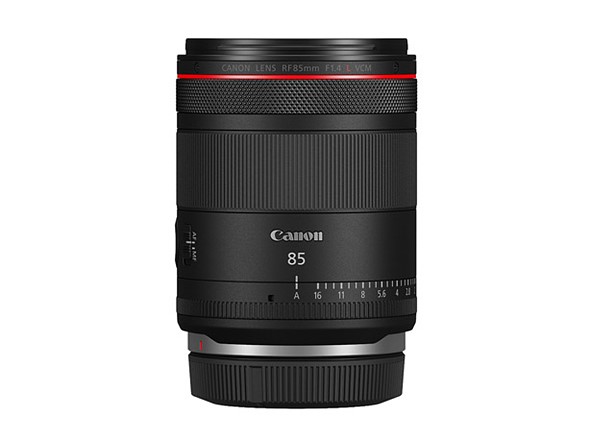 a canon 85mm lens with aperture Ring is on a white background