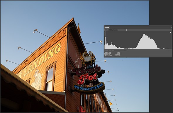a histogram is overlayed on a photo of a building in photoshop