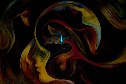 a vibrant blue bird flies over colorful swirls in a small stream