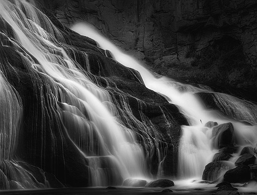 water is blurred Down a rocky waterfall