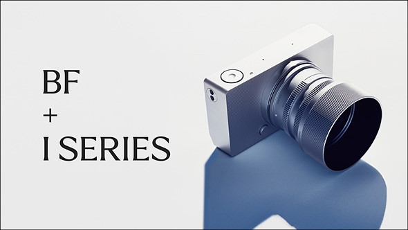 a silver sigma bf with silver lens is on a white background with a strong shadow