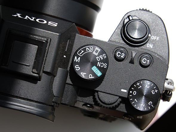 a sony camera sits on a white desk