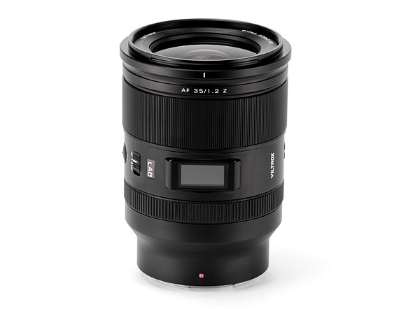 a black lens stands against a white background