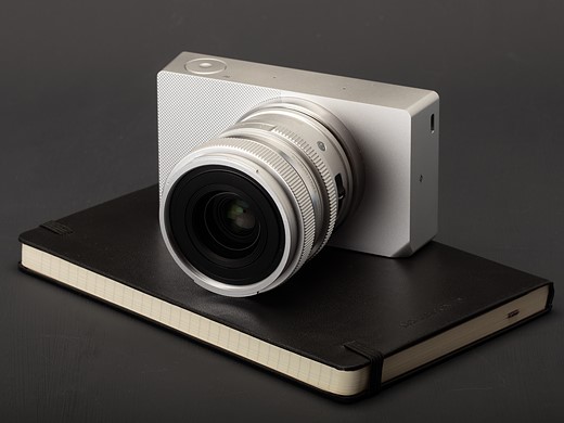 sigma bf sitting atop a moleskin notebook