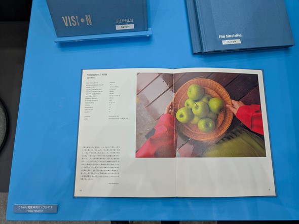 a photo book sits open on a blue table