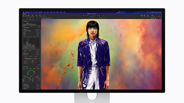 an apple studio display is on a white background with a colorful photo in capture one on the screen