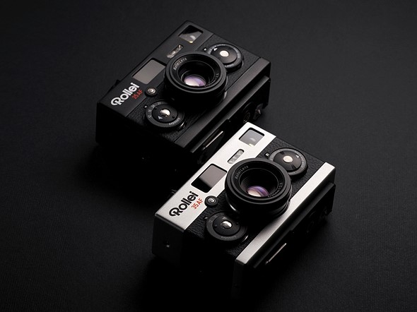 two rectangular cameras are on a black background