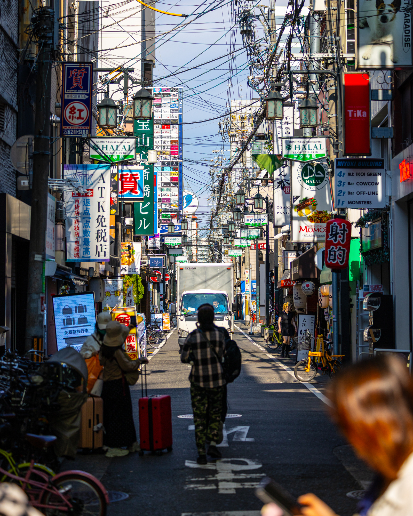 Busy Japanese Street With Colorful Signs by Cenk Salfur