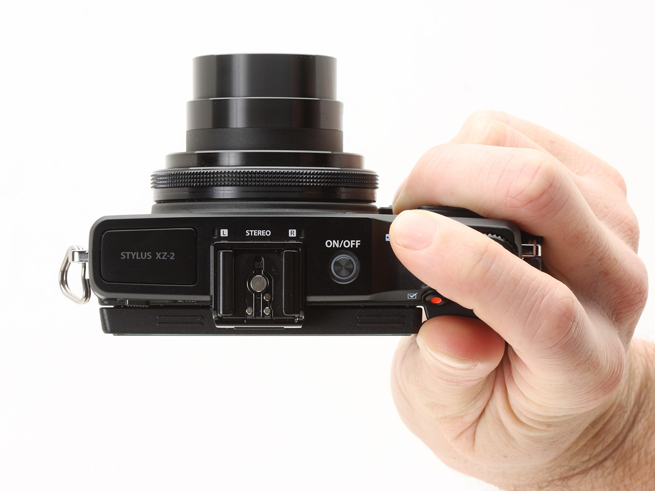 Top-down view of an Olympus XZ-2 in someone's hand