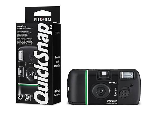 packaging and black camera sit on a white background